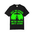 Black t-shirt with green alien abduction graphic and text on a white background