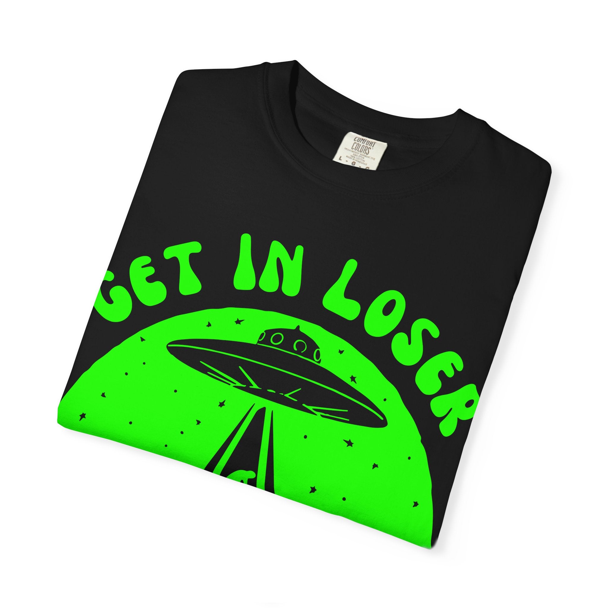 Black t-shirt with green alien spaceship and text on a white background
