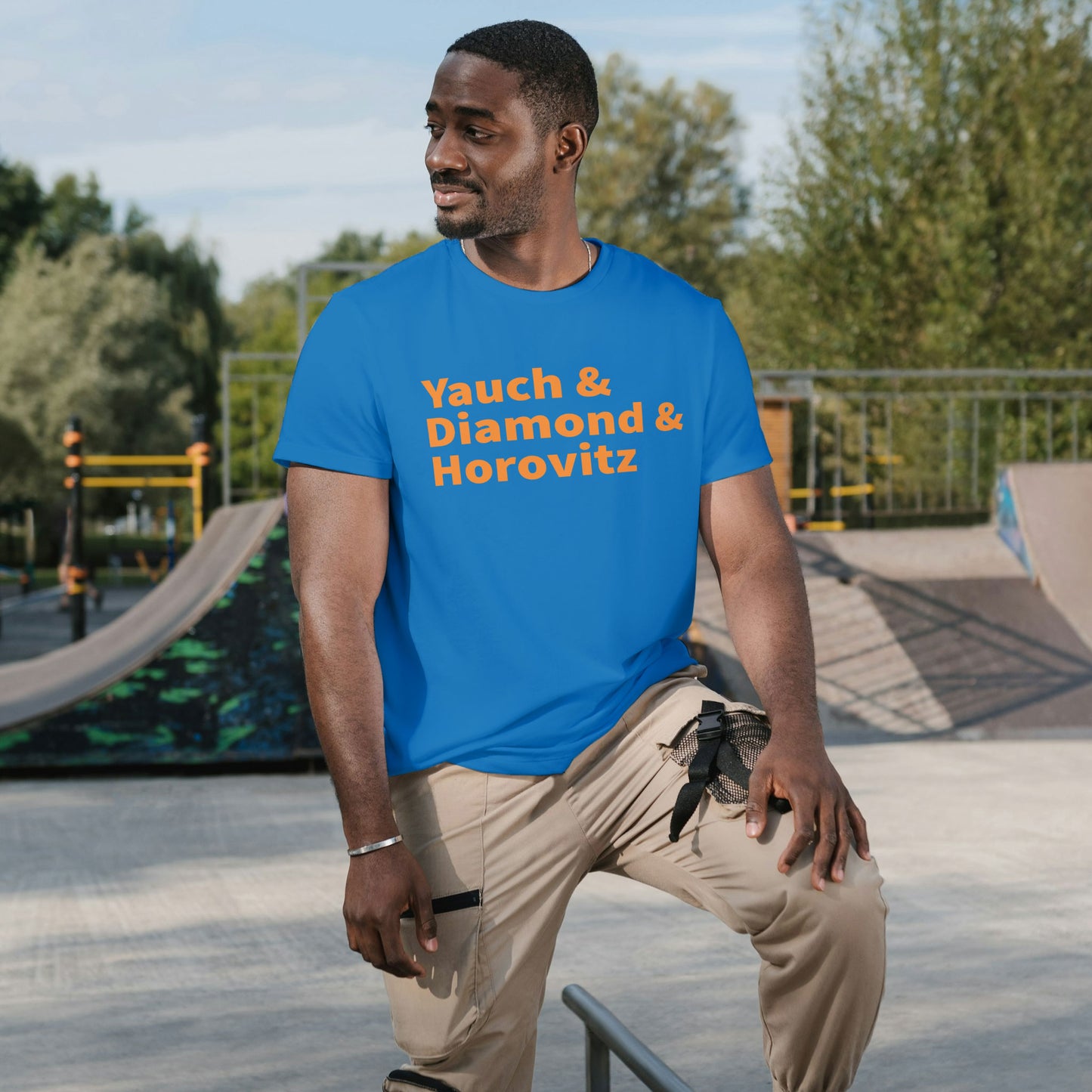 Man wear Yauch • Diamond • Horovitz Tee — Knicks Colors (Blue & Orange) at skate park
